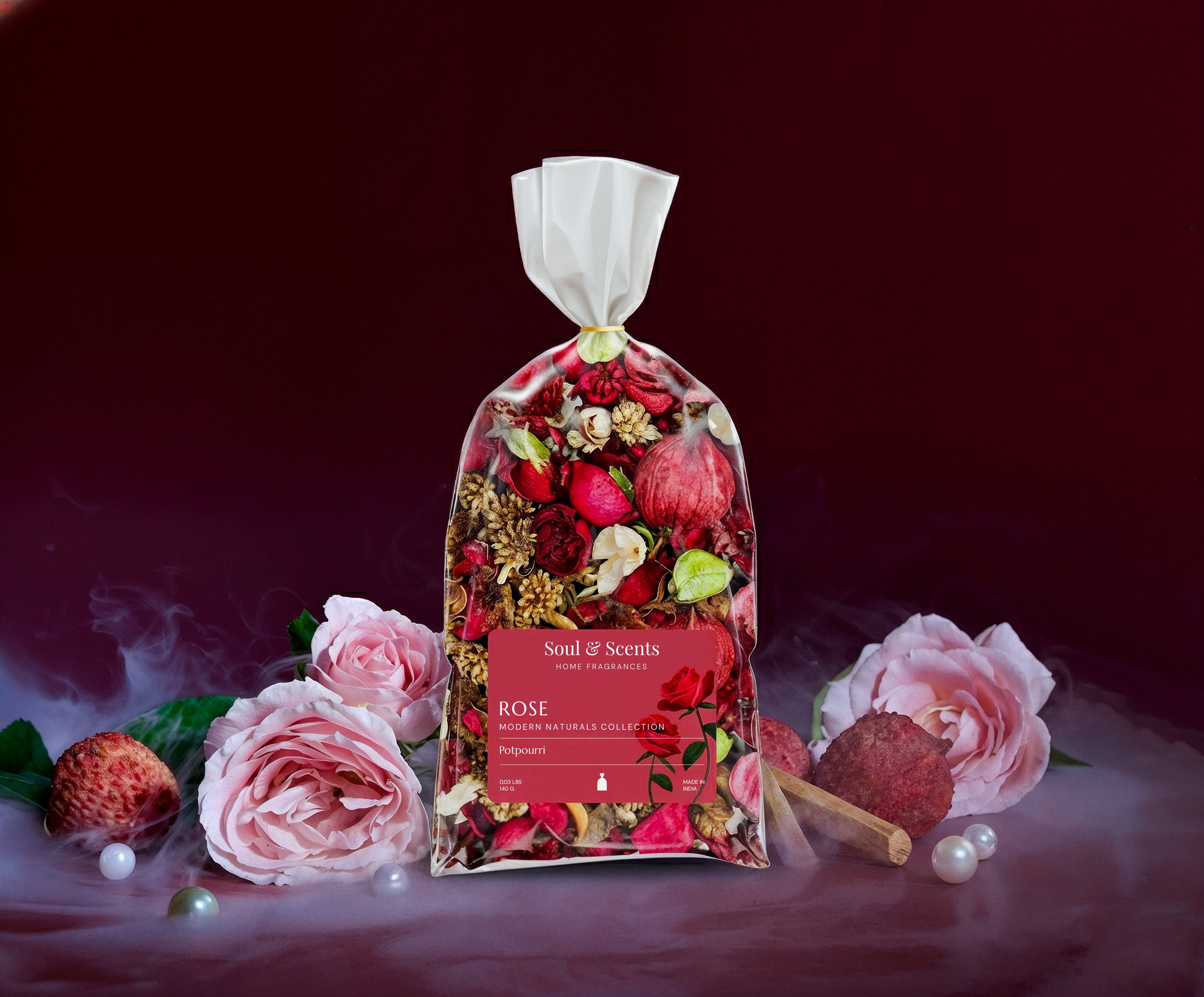 Bag of dried flowers labeled 'Soul & Scents' with pink roses and strawberries on a dark background
