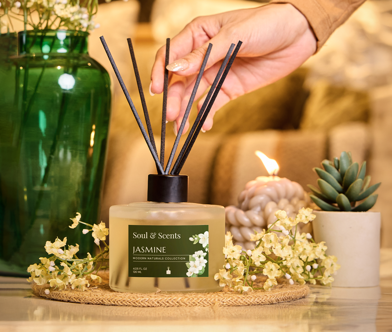Scented diffuser with Jasmine fragrance on a green background