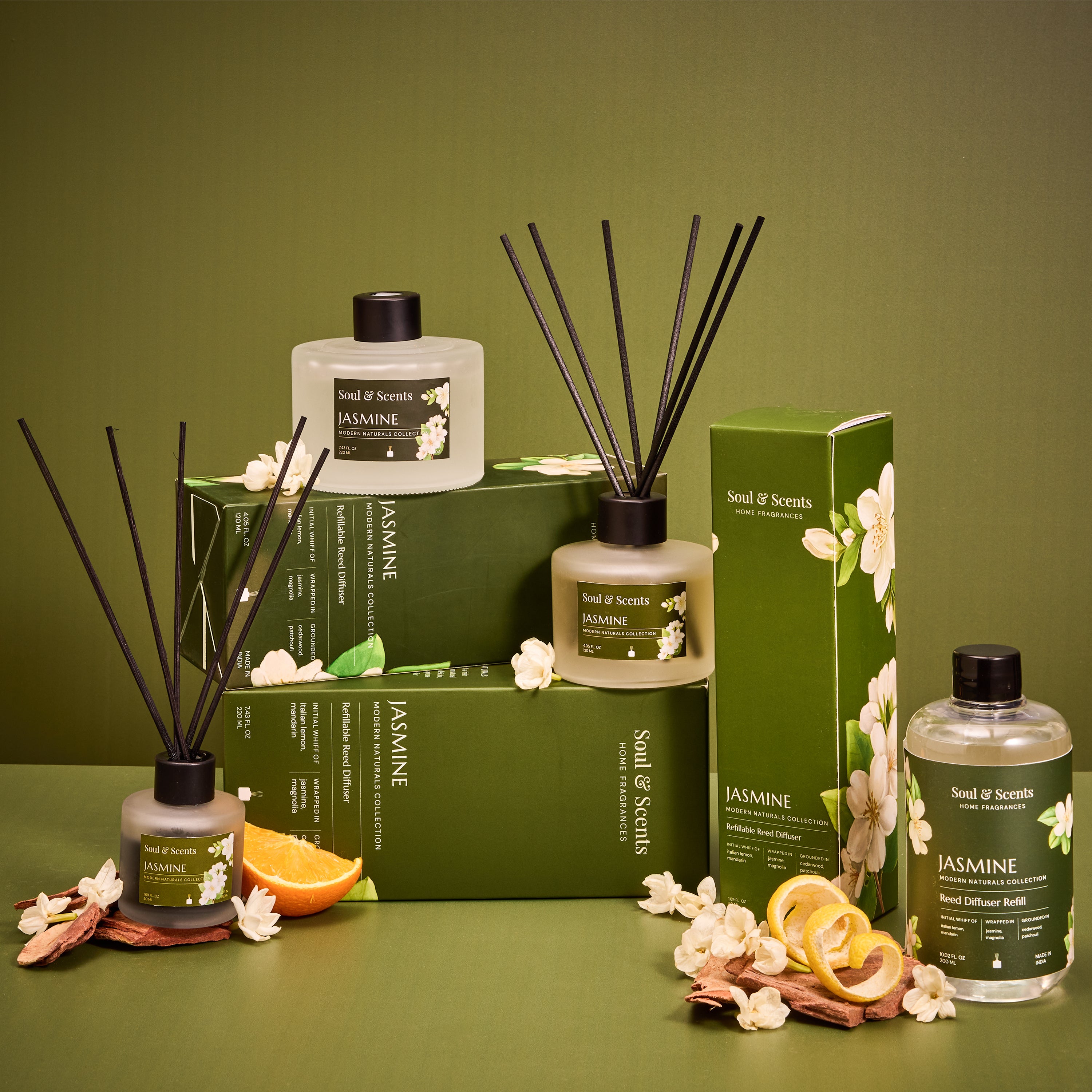 Scent of Scents Jasmine diffuser set with packaging on a green background