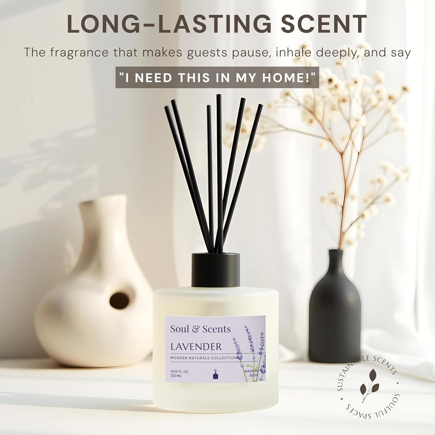Scented diffuser with lavender label on a white surface with decorative vases.